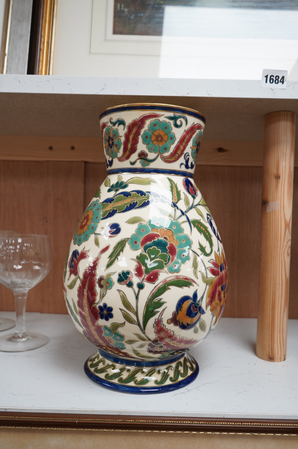 A large Hungarian Zsolnay floral vase, 32cm high. Condition - fair